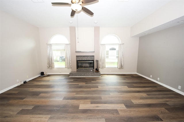 8311 Coral Creek Loop, Hudson, FL 34667 - unfurnished living room with ceiling fan, a premium fireplace, and wood finished floors