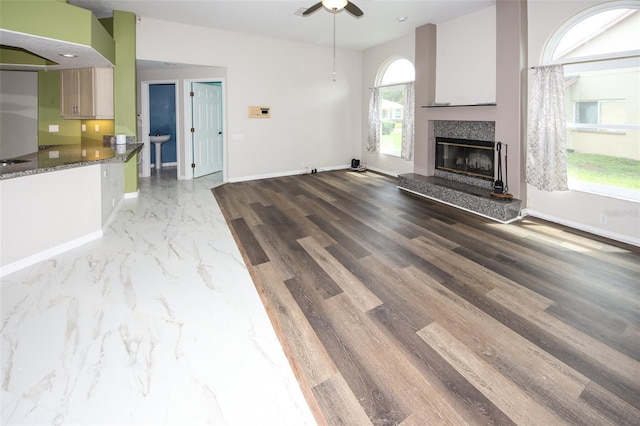 8311 Coral Creek Loop, Hudson, FL 34667 - unfurnished living room with a ceiling fan and a high end fireplace