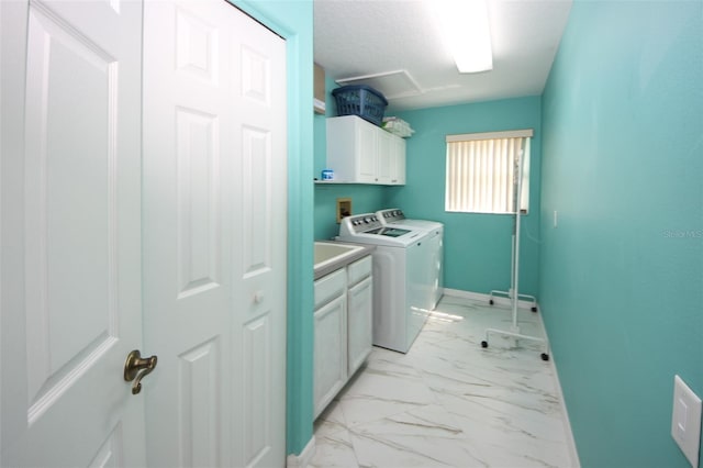 8311 Coral Creek Loop, Hudson, FL 34667 - laundry area featuring cabinet space, washer and clothes dryer, and light marble finish flooring