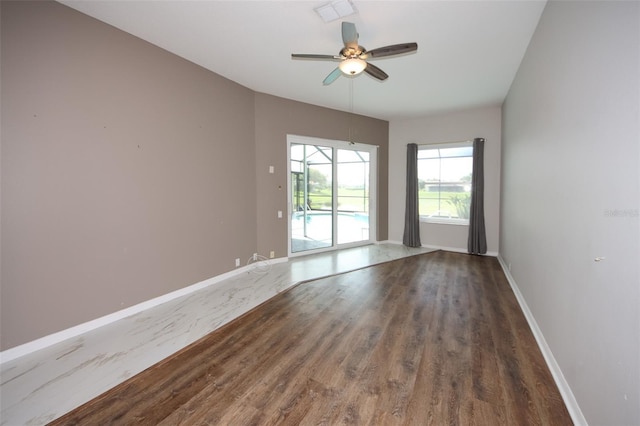 8311 Coral Creek Loop, Hudson, FL 34667 - spare room with wood finished floors and ceiling fan