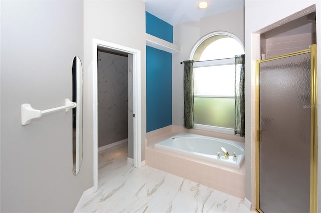8311 Coral Creek Loop, Hudson, FL 34667 - full bath featuring a shower stall, a bath, and marble look tiles