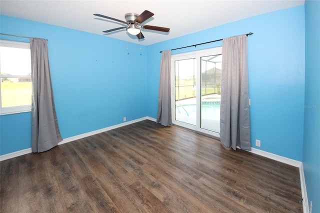 8311 Coral Creek Loop, Hudson, FL 34667 - empty room featuring healthy amount of natural light, dark wood-style floors, and a ceiling fan
