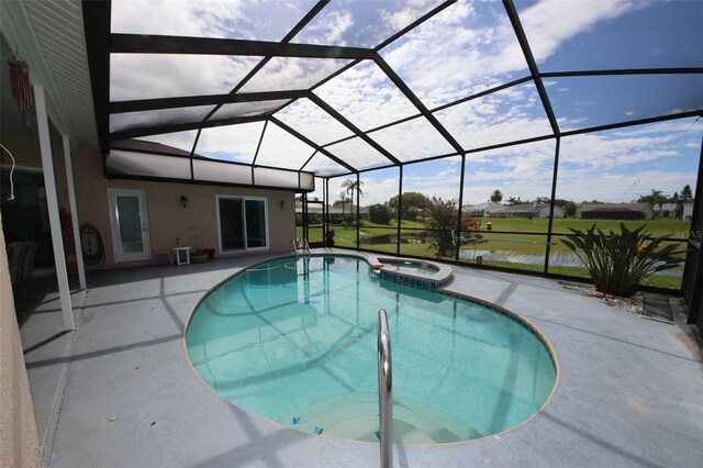 8311 Coral Creek Loop, Hudson, FL 34667 - view of swimming pool featuring a patio area, a pool with connected hot tub, and glass enclosure