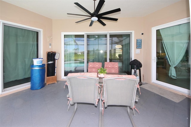 8311 Coral Creek Loop, Hudson, FL 34667 - view of patio with a ceiling fan and outdoor dining area