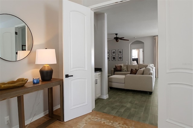 14647 Potterton Cir, Hudson, FL 34667 - hallway featuring dark wood finished floors and arched walkways