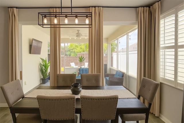 14647 Potterton Cir, Hudson, FL 34667 - dining room with baseboards and ceiling fan