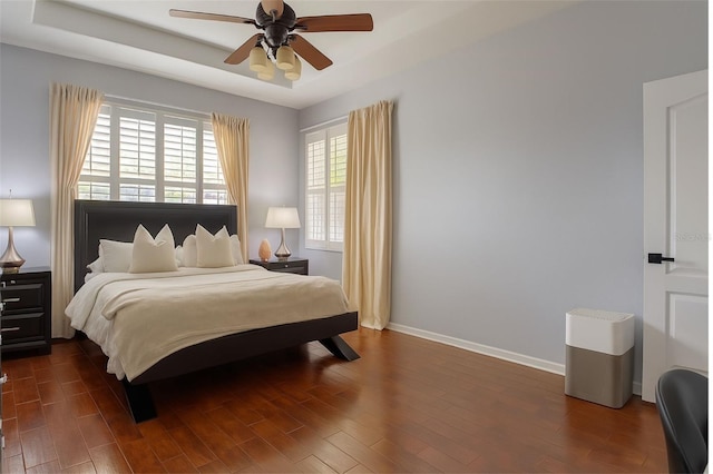 14647 Potterton Cir, Hudson, FL 34667 - bedroom with dark wood-style floors and a ceiling fan