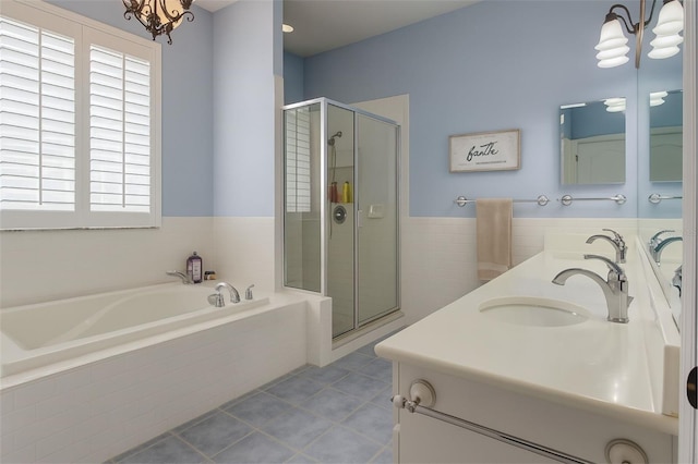 14647 Potterton Cir, Hudson, FL 34667 - full bath featuring a garden tub, tile patterned flooring, a stall shower, and double vanity