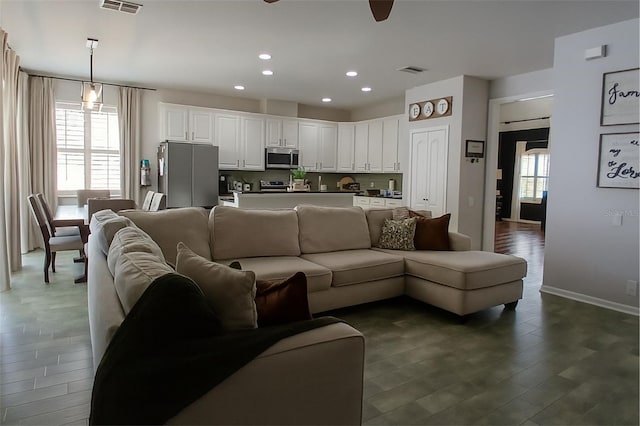 14647 Potterton Cir, Hudson, FL 34667 - living room with ceiling fan, wood finished floors, and recessed lighting