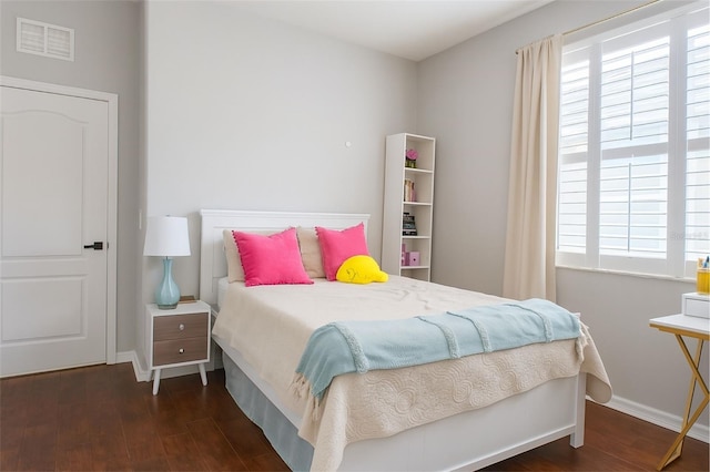 14647 Potterton Cir, Hudson, FL 34667 - bedroom featuring wood finished floors and baseboards