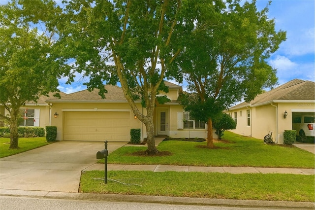 14647 Potterton Cir, Hudson, FL 34667 - ranch-style home featuring a garage, stucco siding, driveway, and a front lawn