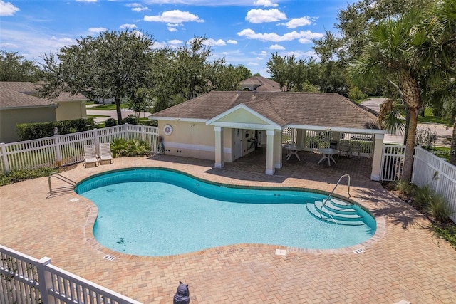 14647 Potterton Cir, Hudson, FL 34667 - community pool featuring a patio area