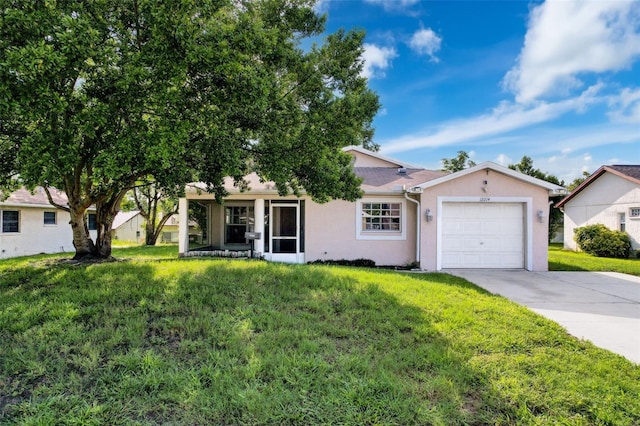 12214 Partridge Hill Row, Hudson, FL 34667 - ranch-style house with an attached garage, concrete driveway, stucco siding, and a front yard