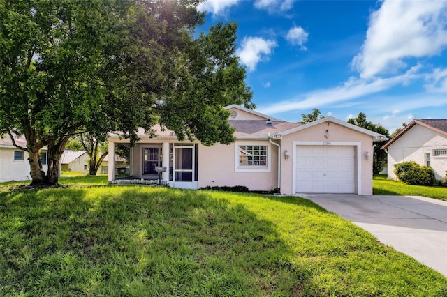 12214 Partridge Hill Row, Hudson, FL 34667 - view of front facade with a garage, driveway, a front lawn, and stucco siding