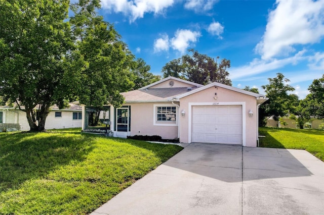 12214 Partridge Hill Row, Hudson, FL 34667 - ranch-style home featuring a garage, concrete driveway, stucco siding, and a front yard