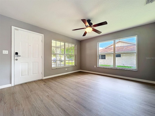 12214 Partridge Hill Row, Hudson, FL 34667 - spare room with wood finished floors and ceiling fan