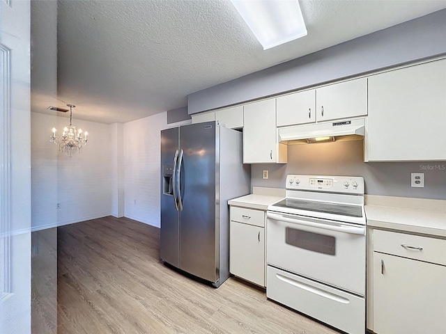 12214 Partridge Hill Row, Hudson, FL 34667 - kitchen featuring white electric stove, under cabinet range hood, stainless steel fridge with ice dispenser, light wood finished floors, and light countertops