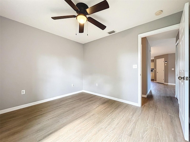 12214 Partridge Hill Row, Hudson, FL 34667 - unfurnished room featuring a smoke detector, wood finished floors, and ceiling fan