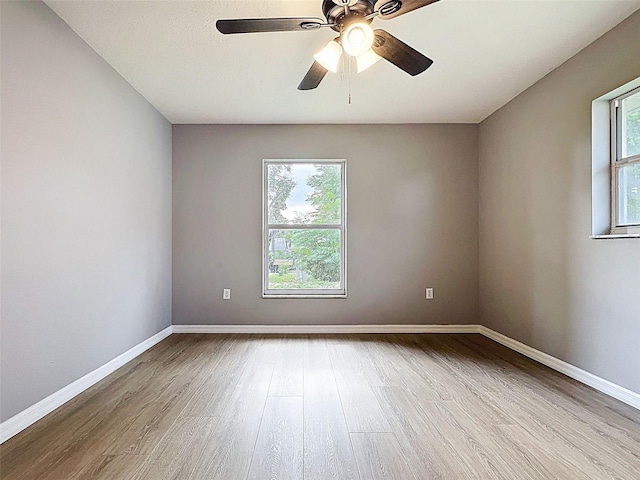 12214 Partridge Hill Row, Hudson, FL 34667 - empty room featuring wood finished floors and ceiling fan
