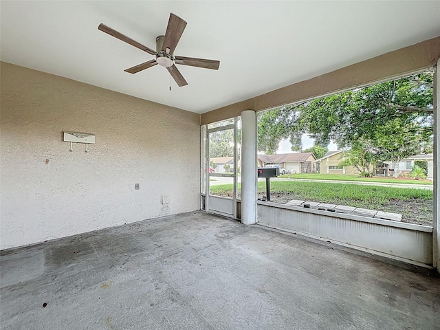 12214 Partridge Hill Row, Hudson, FL 34667 - unfurnished sunroom featuring a ceiling fan