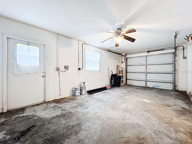 12214 Partridge Hill Row, Hudson, FL 34667 - garage featuring a ceiling fan