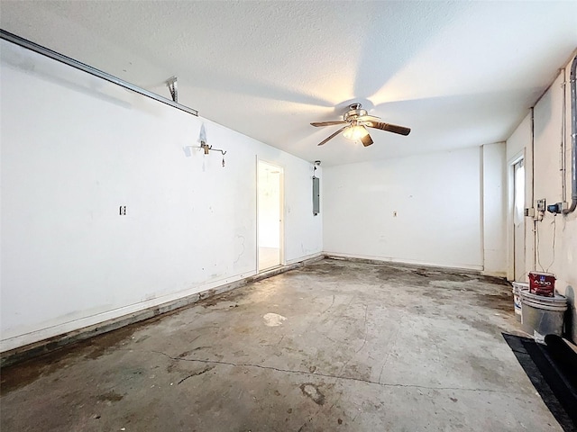 12214 Partridge Hill Row, Hudson, FL 34667 - garage featuring ceiling fan and electric panel