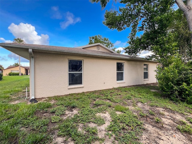 12214 Partridge Hill Row, Hudson, FL 34667 - view of home's exterior featuring stucco siding