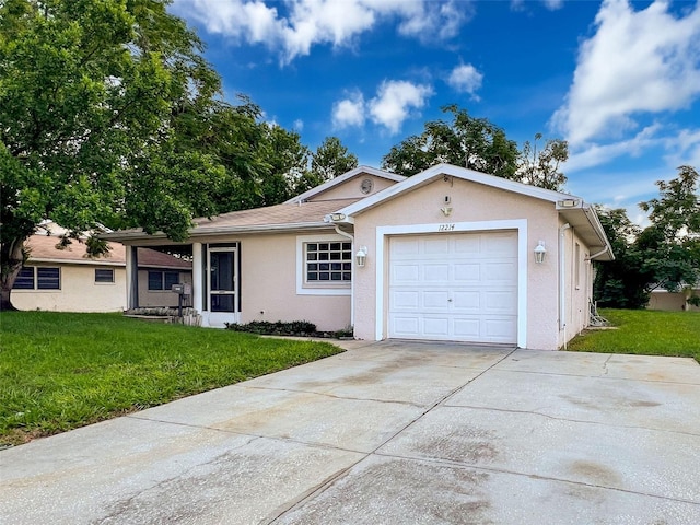 12214 Partridge Hill Row, Hudson, FL 34667 - ranch-style house with stucco siding, a front yard, an attached garage, and driveway