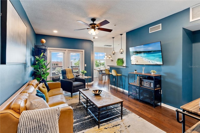 2010 E Palm Ave Unit 14312, Tampa, FL 33605 - living room with a ceiling fan, wood finished floors, and a textured ceiling