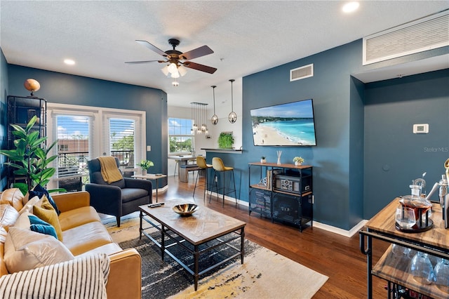 2010 E Palm Ave Unit 14312, Tampa, FL 33605 - living room featuring a ceiling fan, wood finished floors, recessed lighting, a textured ceiling, and a chandelier