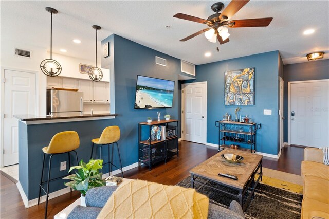 2010 E Palm Ave Unit 14312, Tampa, FL 33605 - living room featuring ceiling fan, wood finished floors, and recessed lighting