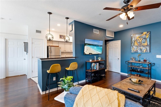 2010 E Palm Ave Unit 14312, Tampa, FL 33605 - living area featuring ceiling fan, dark wood-type flooring, recessed lighting, and a textured ceiling