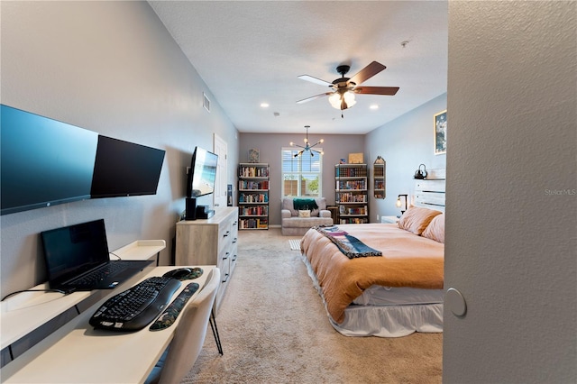 2010 E Palm Ave Unit 14312, Tampa, FL 33605 - bedroom featuring light colored carpet, a chandelier, a ceiling fan, and a textured wall