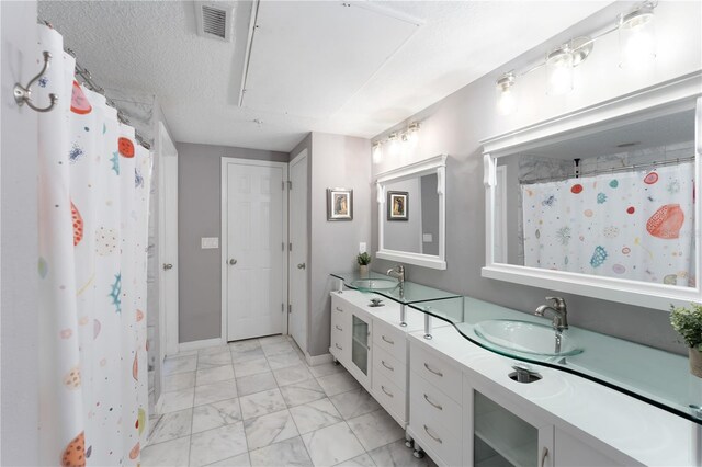 2010 E Palm Ave Unit 14312, Tampa, FL 33605 - bathroom with marble finish flooring, double vanity, and curtained shower