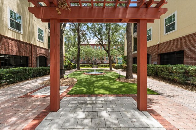2010 E Palm Ave Unit 14312, Tampa, FL 33605 - view of patio with a pergola