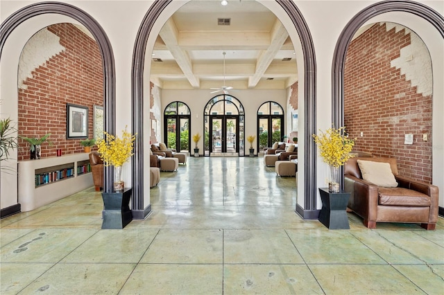 2010 E Palm Ave Unit 14312, Tampa, FL 33605 - building lobby with beam ceiling, coffered ceiling, brick wall, and a high ceiling