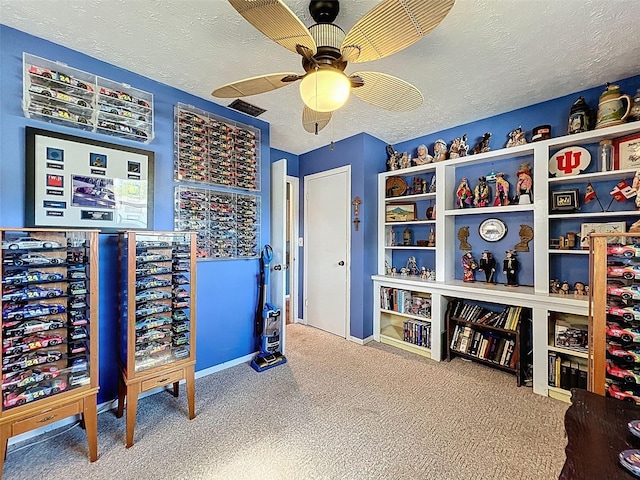 8640 Horizon Ln, Hudson, FL 34667 - home office with a textured ceiling, carpet, and a ceiling fan