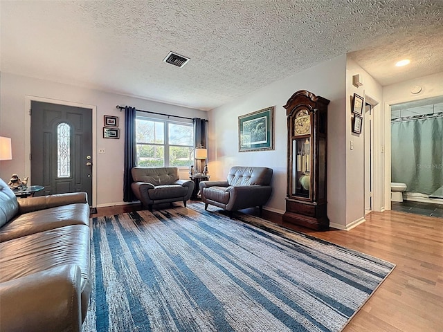 8640 Horizon Ln, Hudson, FL 34667 - living area with wood finished floors and a textured ceiling