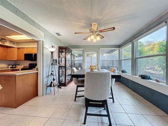 8640 Horizon Ln, Hudson, FL 34667 - sunroom / solarium with tile patterned floors, plenty of natural light, and a textured ceiling