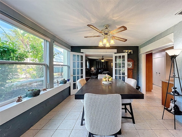 8640 Horizon Ln, Hudson, FL 34667 - sunroom featuring tile patterned floors and a textured ceiling
