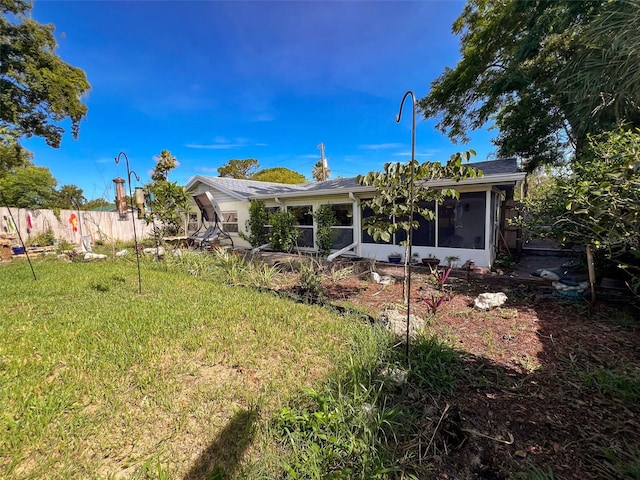 8640 Horizon Ln, Hudson, FL 34667 - back of house with a sunroom