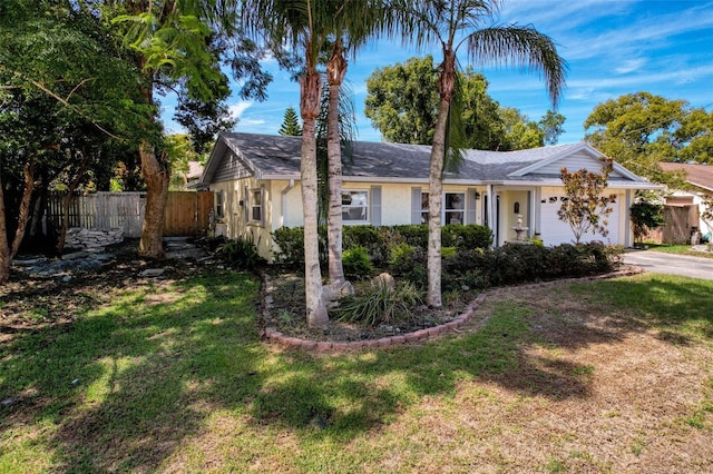 8640 Horizon Ln, Hudson, FL 34667 - ranch-style house featuring an attached garage, asphalt driveway, and stucco siding