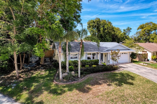 8640 Horizon Ln, Hudson, FL 34667 - ranch-style house featuring an attached garage and driveway