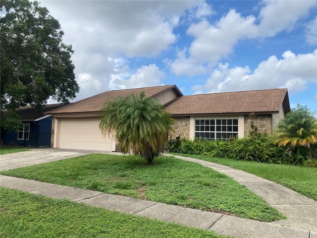 7806 Jenner Ave, New Port Richey, FL 34655 - single story home with stone siding, a garage, concrete driveway, and a front lawn