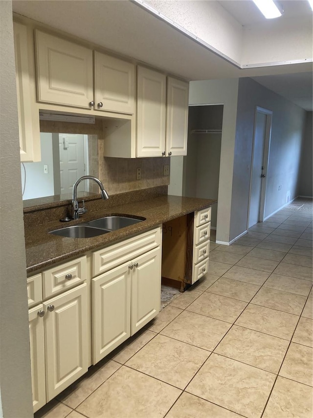 7806 Jenner Ave, New Port Richey, FL 34655 - kitchen with light tile patterned floors and dark stone counters