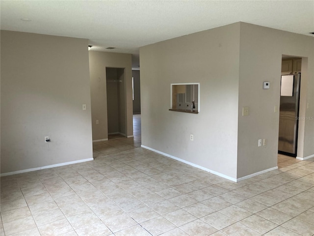 7806 Jenner Ave, New Port Richey, FL 34655 - spare room with light tile patterned floors and baseboards