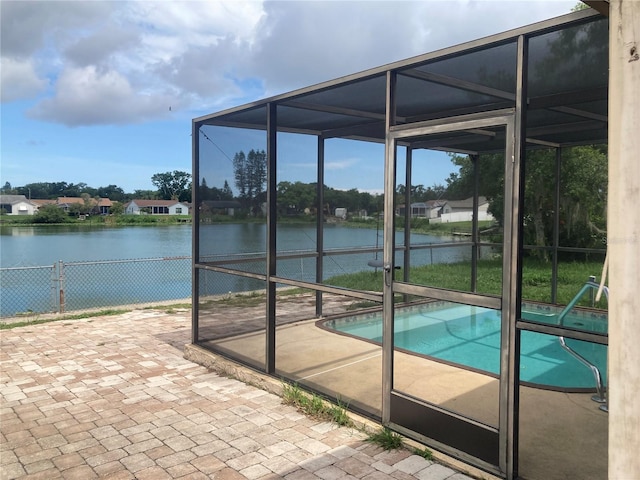 7806 Jenner Ave, New Port Richey, FL 34655 - outdoor pool featuring a patio and a water view