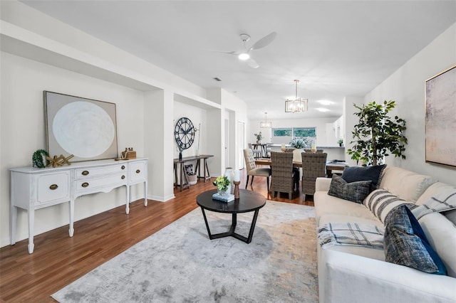 11619 Crest Creek Dr, Riverview, FL 33569 - living area featuring ceiling fan, wood finished floors, and a chandelier