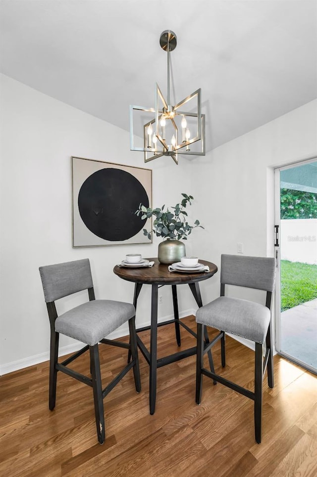 11619 Crest Creek Dr, Riverview, FL 33569 - dining area featuring wood finished floors and a chandelier