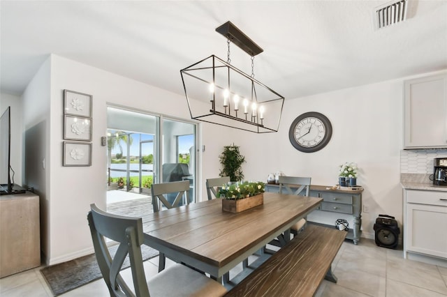 11861 Downy Birch Dr, Riverview, FL 33569 - dining space featuring light tile patterned floors and a chandelier